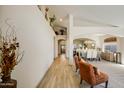 Bright hallway leads to the dining and living areas with decorative touches and neutral walls at 4762 E White Aster St, Phoenix, AZ 85044