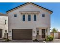 Charming home with two-car garage, a covered entryway, and well-maintained landscaping at 5518 S Dillon Cir, Mesa, AZ 85212