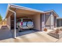 Charming single-story home featuring a covered carport and beautifully landscaped front yard at 5735 E Mcdowell Rd # 464, Mesa, AZ 85215