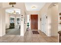 Welcoming foyer with neutral colors leads to an open living space, showcasing the beautiful tile flooring at 6141 S Bradshaw Way, Chandler, AZ 85249