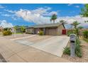 Lovely home with a spacious driveway, well-kept landscaping, and inviting curb appeal at 711 W El Alba Way, Chandler, AZ 85225