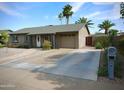 Charming single-story home featuring a well-kept yard, a driveway, and a desert landscape at 711 W El Alba Way, Chandler, AZ 85225