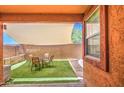 Private outdoor living space with covered patio, artificial grass, and desert views at 7242 S 48Th Gln, Laveen, AZ 85339
