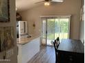 Eat-in kitchen with granite island, stainless appliances and access to a backyard at 9726 E Butte St, Mesa, AZ 85207