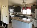 Well-equipped kitchen with granite countertops, subway tile backsplash, and modern appliances at 9726 E Butte St, Mesa, AZ 85207