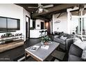 Cozy living room with stylish decor, a modern entertainment center, and comfortable seating at 1 E Lexington Ave # 1209, Phoenix, AZ 85012