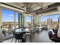 Open living room featuring dining area, comfortable seating, and expansive views of the city skyline at 1 E Lexington Ave # 1209, Phoenix, AZ 85012