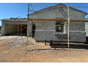 Exterior view of home being built with scaffolding at 11416 E Utah Ave, Mesa, AZ 85212