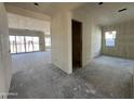 Living room and open floor plan view with windows and door to exterior at 11416 E Utah Ave, Mesa, AZ 85212