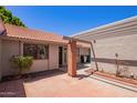 Inviting front entrance with brick accents and a shaded pergola at 129 Leisure World --, Mesa, AZ 85206