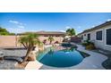 Sparkling pool and spa surrounded by lush landscaping, creating a private backyard oasis at 1970 E Yellowstone Pl, Chandler, AZ 85249