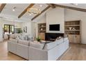 Cozy living room with a fireplace, built-in shelving, and comfortable seating for relaxing or entertaining at 4456 E Earll Dr, Phoenix, AZ 85018