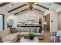 Inviting living room boasts a vaulted ceiling, custom cabinets, and a seamless transition to the kitchen at 4456 E Earll Dr, Phoenix, AZ 85018