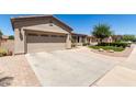 Spacious two-car garage with an extended driveway and well-kept landscaping at 4626 E Blue Spruce Ln, Gilbert, AZ 85298