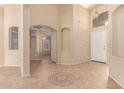 Spacious entryway featuring archways, neutral paint, tile flooring, and a view to the living room at 4826 W Ardmore Rd, Laveen, AZ 85339