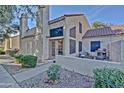 Townhouse featuring private front patio with grill, desert landscaping, and inviting curb appeal at 602 N May -- # 23, Mesa, AZ 85201