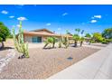 Lovely single-story home with desert landscaping, mature palm trees and cactus, and a two-car carport at 8318 E Via De Los Libros --, Scottsdale, AZ 85258