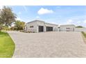 Long driveway leading to a large 3-car garage, perfect for car enthusiasts at 9611 E Clinton St, Scottsdale, AZ 85260