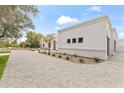 Well-maintained home featuring a spacious driveway and landscaped front yard at 9611 E Clinton St, Scottsdale, AZ 85260