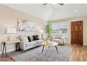 Comfortable living room with cozy seating, neutral decor, and an abundance of natural light through shuttered windows at 10015 E Mountain View Rd # 2034, Scottsdale, AZ 85258