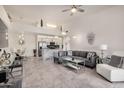 Open-concept living room with dining area and kitchen, featuring modern furniture and fixtures at 10136 E Southern Ave # 3091, Mesa, AZ 85209
