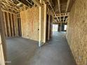 Spacious interior showcasing exposed wood framing and concrete floors throughout at 11444 E Utopia Ave, Mesa, AZ 85212