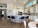 Spacious kitchen with a large island, stainless steel appliances, and stylish barstool seating at 12753 W Vista Paseo Dr, Litchfield Park, AZ 85340