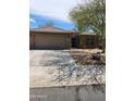 Charming single-Gathering home featuring a spacious driveway and desert landscaping for low maintenance appeal at 1333 E Cecil Ct, Casa Grande, AZ 85122