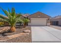 Charming single-story home featuring desert landscaping and a spacious driveway at 13523 W Remuda Dr, Peoria, AZ 85383