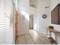 Bright foyer with wood floors, high ceilings, and contemporary decor create an inviting entrance at 13584 N 102Nd Pl, Scottsdale, AZ 85260
