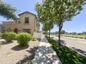 Beautifully landscaped home with mature shade trees lining a sidewalk, adding to the neighborhood's appeal at 1492 S Pike Ln, Gilbert, AZ 85296