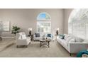 Bright living room with cathedral ceilings, plantation shutters, and neutral decor at 15237 S 19Th Way, Phoenix, AZ 85048