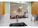 View from the kitchen into the living room, offering an open concept layout at 15558 N Ulrich Way, Surprise, AZ 85374