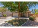 Two-story home with neutral stucco, stone accents and a 2 car garage at 17235 W Statler St, Surprise, AZ 85388