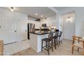 Bright kitchen with white cabinets, stainless steel appliances, and a breakfast bar at 20100 N 78Th Pl # 1048, Scottsdale, AZ 85255