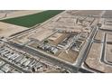 Aerial view of a new residential development with neatly planned streets and green spaces in a desert landscape at 24191 W Agora Ln, Buckeye, AZ 85326