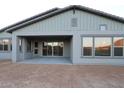 Covered patio in the backyard with sliding glass doors and ample natural light at 32541 N 135Th Dr, Peoria, AZ 85383