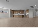 Spacious kitchen featuring custom cabinetry, modern appliances, and large center island at 32541 N 135Th Dr, Peoria, AZ 85383