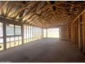 Spacious view of a new construction interior with exposed framing at 32637 N Newby Dr, San Tan Valley, AZ 85143