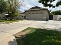 Single-story home with a two-car garage and well-maintained front lawn and driveway at 3677 E Park Ave, Gilbert, AZ 85234