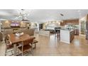 Spacious living room featuring a stone fireplace and modern lighting fixtures at 401 E Braeburn Dr, Phoenix, AZ 85022