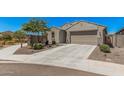 Well-maintained house with desert landscaping and a spacious driveway at 4114 S 106Th Dr, Tolleson, AZ 85353