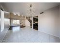 Bright living room with hardwood and tile floors and a view of the kitchen at 4306 E Raven Rd, Phoenix, AZ 85044