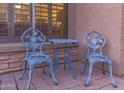 Relaxing patio area with stylish chairs and table, ideal for outdoor lounging near the home at 712 W Jade Dr, Chandler, AZ 85248