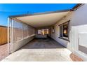 Carport features a covered area and screened-in porch, providing comfortable outdoor living at 7442 E Baseline Rd, Mesa, AZ 85209