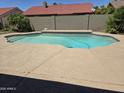 Backyard pool featuring an inviting backyard pool, perfect for relaxation and entertainment with hardscape and patio at 11106 E Clinton St, Scottsdale, AZ 85259