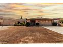 Charming single-story home showcasing a well-maintained front yard with a two car garage at 18814 N 33Rd Ave, Phoenix, AZ 85027