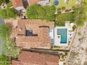 Expansive home with a private pool, luscious landscaping, and a lovely rooftop courtyard at 19829 N 97Th St, Scottsdale, AZ 85255