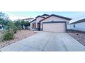 Single-story home featuring a well-maintained front yard with gravel and a two-car garage at 22755 W Yavapai St, Buckeye, AZ 85326