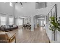 Spacious living room boasts an open floor plan, high ceilings, and wood floors at 3349 E Flamingo Ct, Gilbert, AZ 85297